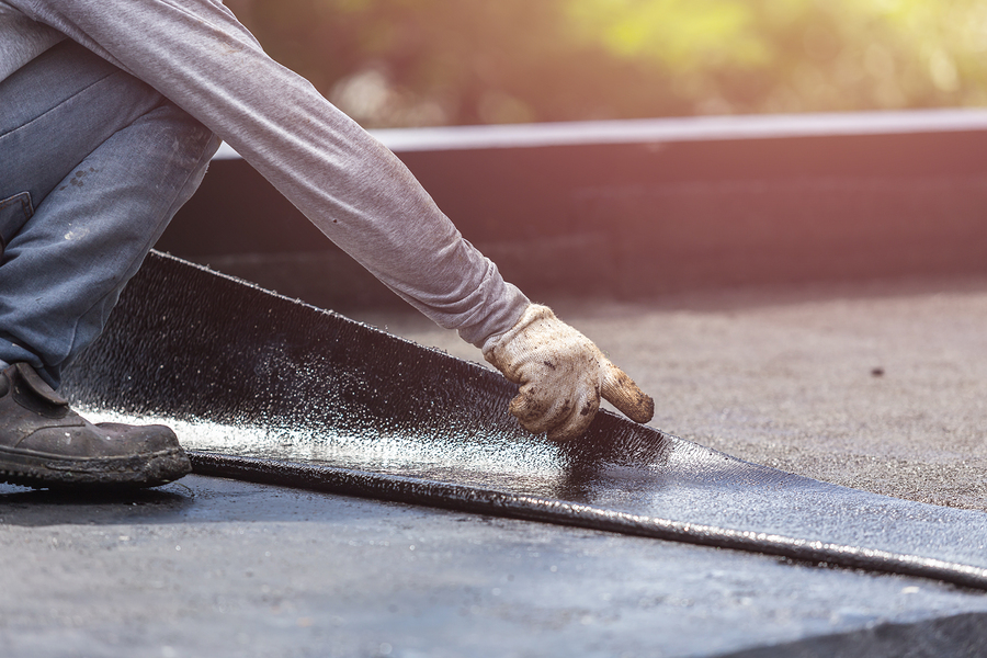 concrete expert working on driveway installation